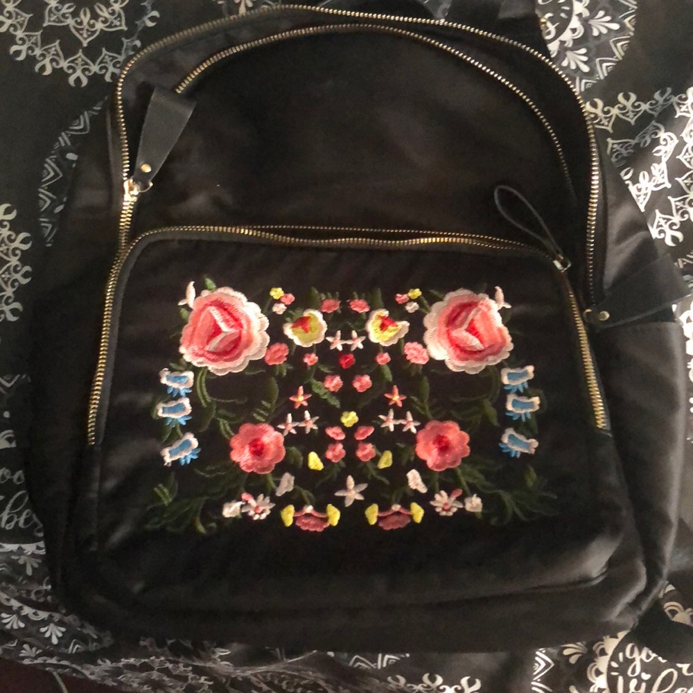 Embrioded rose backpack